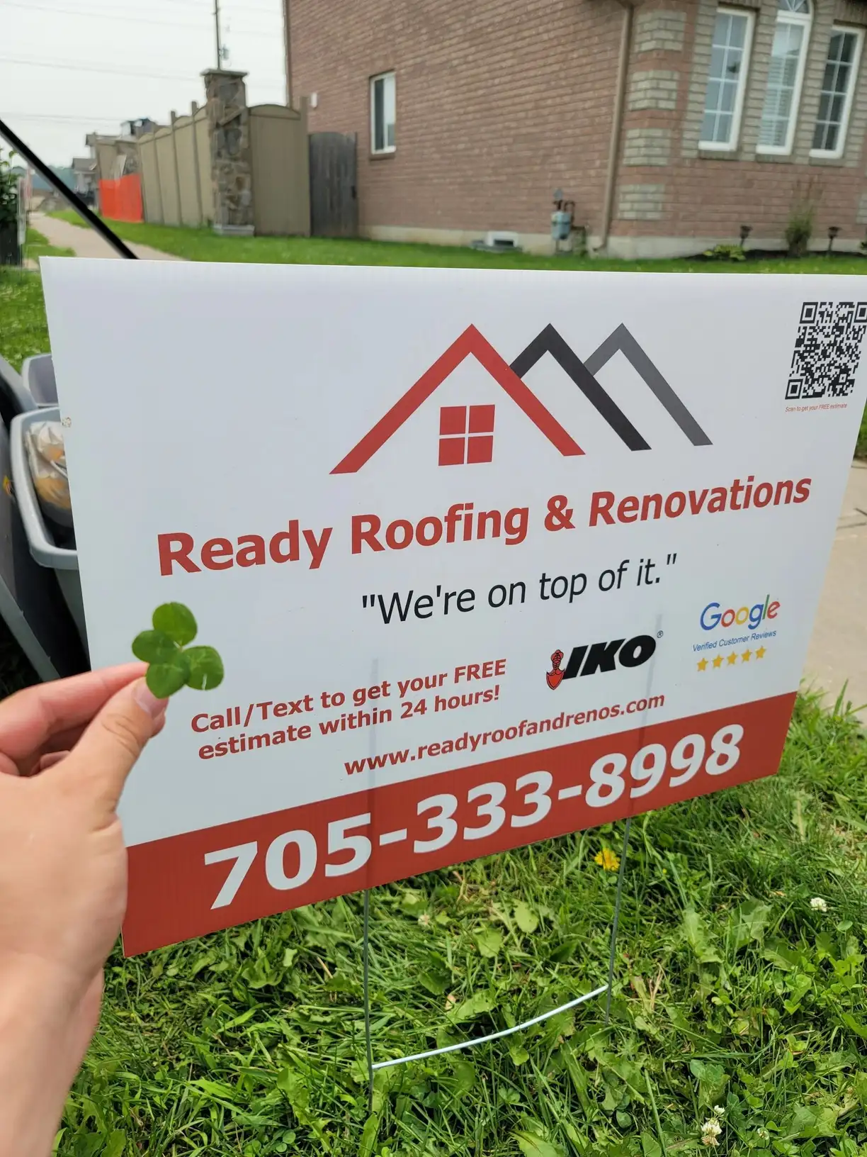 An asphalt shingle roof installed by the Ready Roofing & Renovations crew.